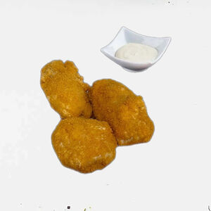 Куриные наггетсы с белым соусом