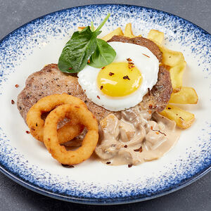 Отбивная из свинины с грибами с картофельными дольками