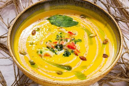 Тыквенный суп с ореховым муссом и крабом