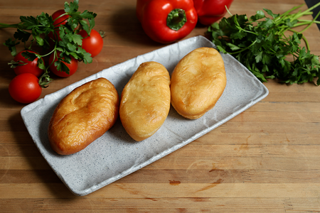 Пирожок с рисом и яйцом 75 гр./жареный/