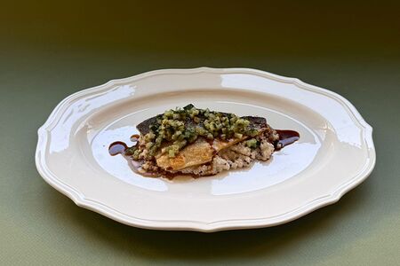 Сибас с киноа и гранатовым соусом