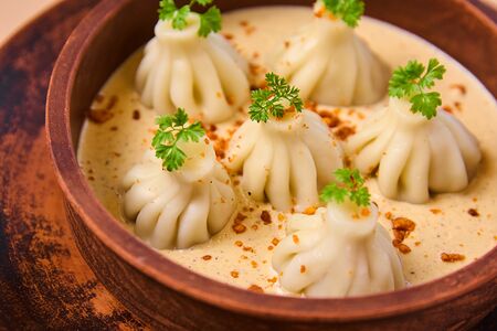 Хинкалиоли в сливочно-ореховом соусе