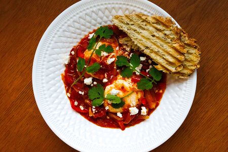 Шакшука из двух яиц с брынзой