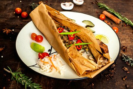 Сибас целиком в пергаменте