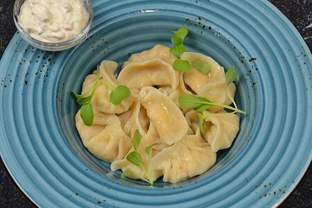 Пельмени из семги и судака с соусом тартар