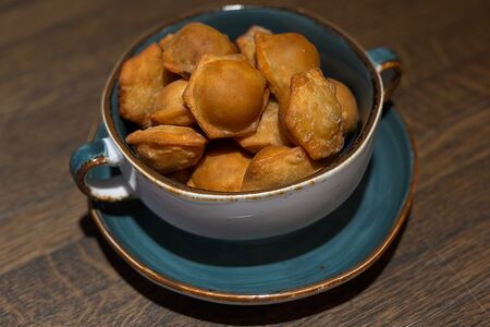 Пельмени жареные 