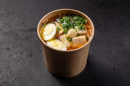 Бульон с курицей, яйцом и сухарями