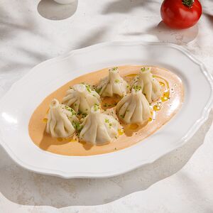 Патара хинкали в соусе Том ям