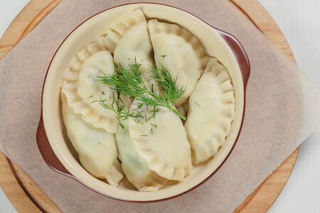 Большая порция вареников Хуран кукли с яйцом и зелёным луком