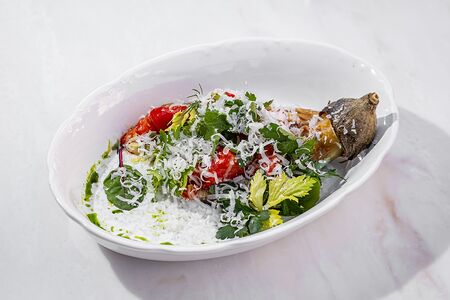 Запеченный баклажан с жареными томатами и соусом дзадзики