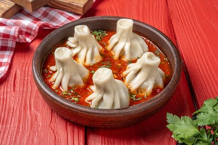 Хинкали в соусе аджика 