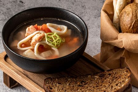 Уха с лососем, палтусом и кальмаром