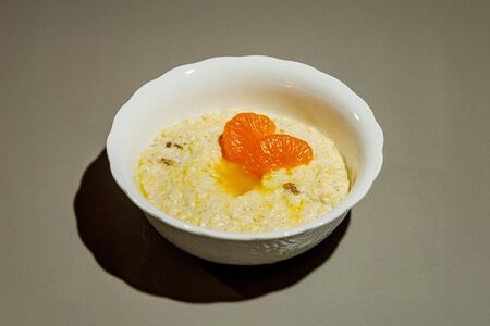 Каша пшенная с творогом и изюмом