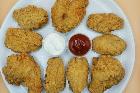 9 Куриных крылышек в панировке (легкая остринка)