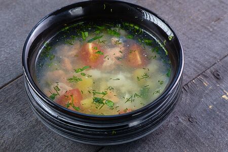 Уха с костра с двумя видами рыб