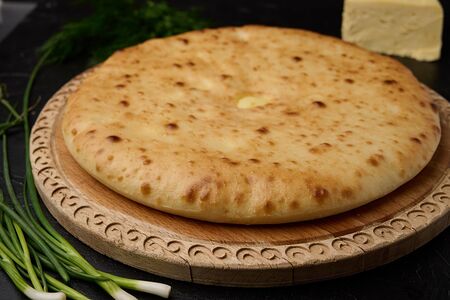Осетинский пирог с курицей, сыром и зеленым луком