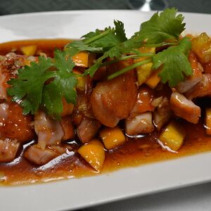 Тушеная курица с апельсином