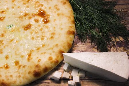 Пирог с осетинским сыром, моцареллой и зеленью