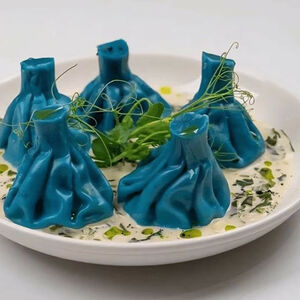 Хинкали с креветкой и кальмаром в соусе