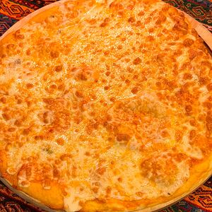 Пицца четыре сыра