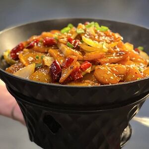 Картофель ломтиками на огне