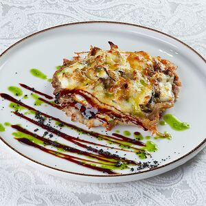 Свинина запеченная с баклажанами и грибами под сыром