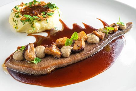 Язык телячий с грибным соусом