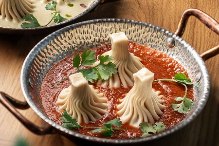 Хинкали с томатным соусом