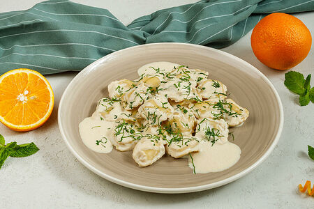 Равиоли с рикоттой в сырном соусе с цитрусовым ароматом