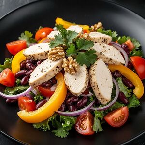Салат из запеченной куриной грудки, овощей и грецких орехов
