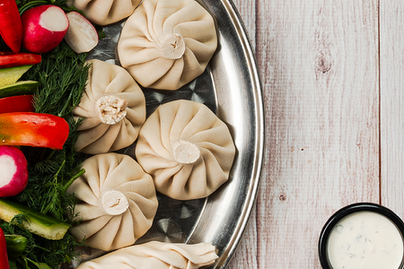 Хинкали с курицей и томатами