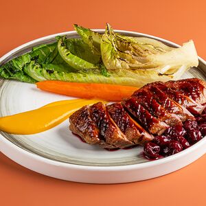 Утиное филе, морковный крем, обжаренный лист романо, варенье из вишни компоте, морковь в апельсиновой карамели