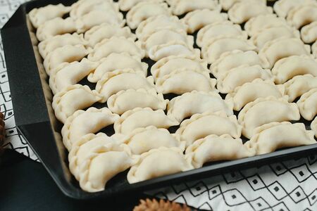 Замороженные вареники с мясом и капустой