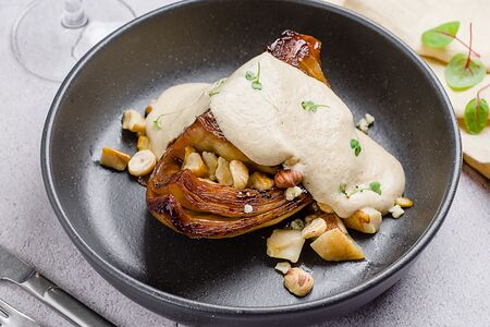 Стейк из молодой капусты с муссом из белых грибов, сыром дорблю и фундуком