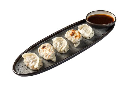 Гедза с томлёнными щечками и соусом демиглас