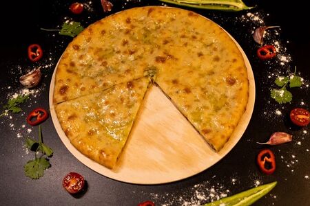 Осетинский пирог с сыром и зеленым луком