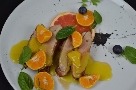 Утиная грудка с рататуем из груши и вишневым соусом