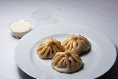 Хинкали с соусом тузлук