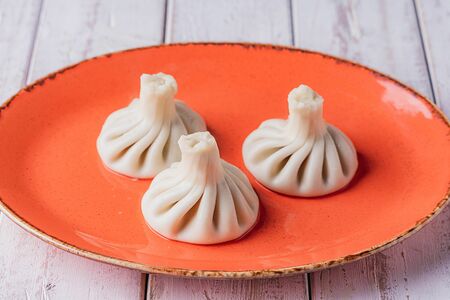 Хинкали с говядиной, свининой и зеленью