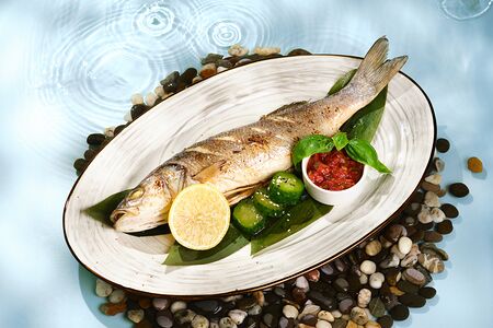 Сибас запеченный целиком с томатами