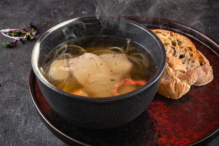 Бульон с индейкой и перепелиным яйцом