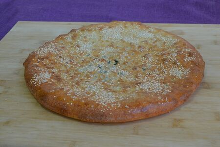 Осетинский пирог с зеленью и сыром