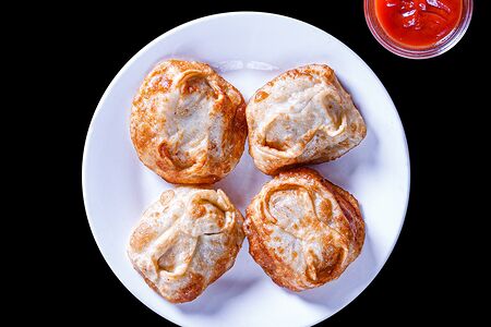 Манты, жаренные со свининой