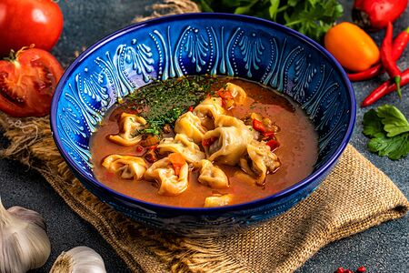 Чучвара ручной лепки с бараниной в мясном бульоне с овощами