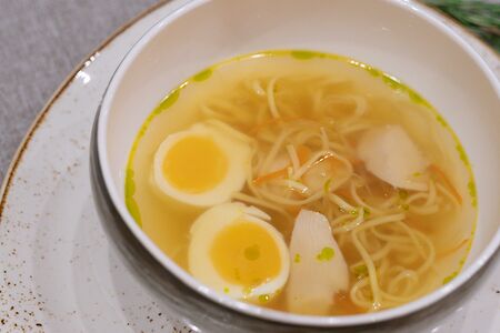Куриный бульон с домашней лапшой и яйцом