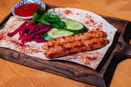 Колбаски на углях