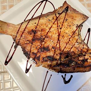 Рыба камбала на углях