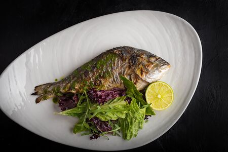 Рыба дорадо целая под соусом песто