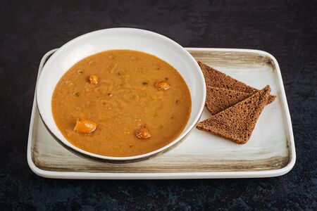 Густой крем-суп из белых грибов с маринованными опятами и хвойным маслом