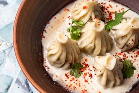 Мини-хинкали в соусе Том Кха